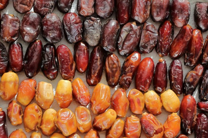 Rows of dried dates in different shades of brown