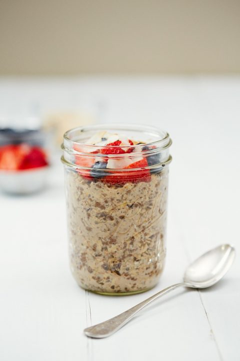 Clear glass jar filled with brown cocoa powder