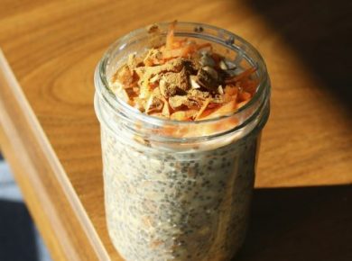 A jar of overnight oats sitting on a wooden table