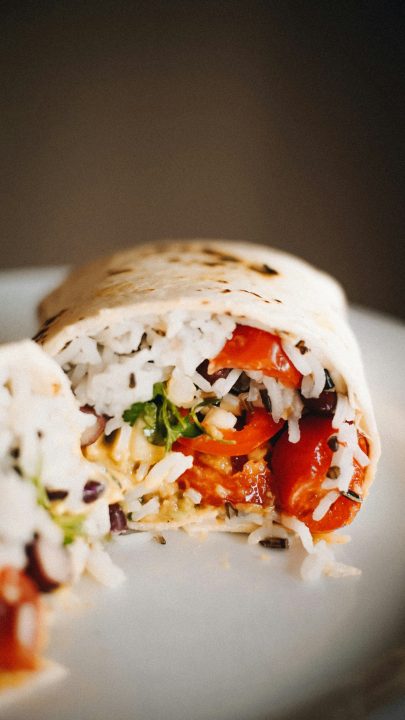 A close-up of a burrito on a plate