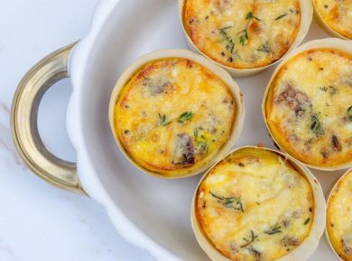 A white plate topped with mini quiches covered in cheese, a make-ahead high protein breakfast