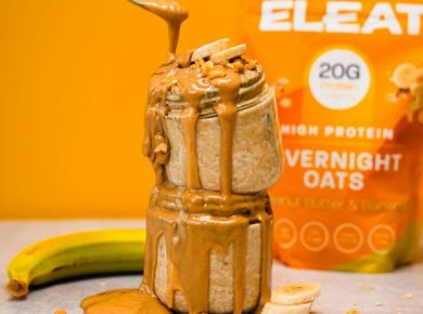 Peanut butter poured over stacked overnight oats jars
