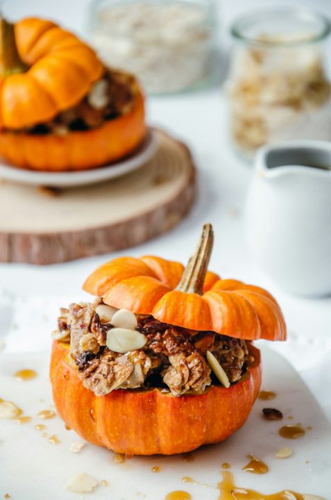 Close-up of a small pumpkin filled with granola crumble